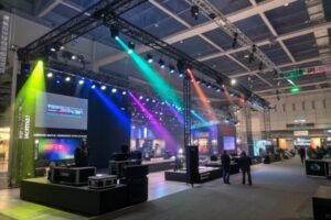 Colorful stage lighting at a tech exhibition, showcasing advanced technology and setups